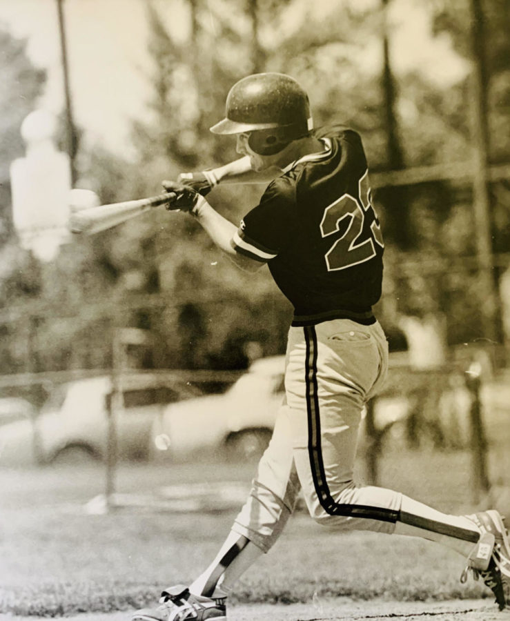 Principal, Matt Jones up to bat at one of his high school baseball games. 