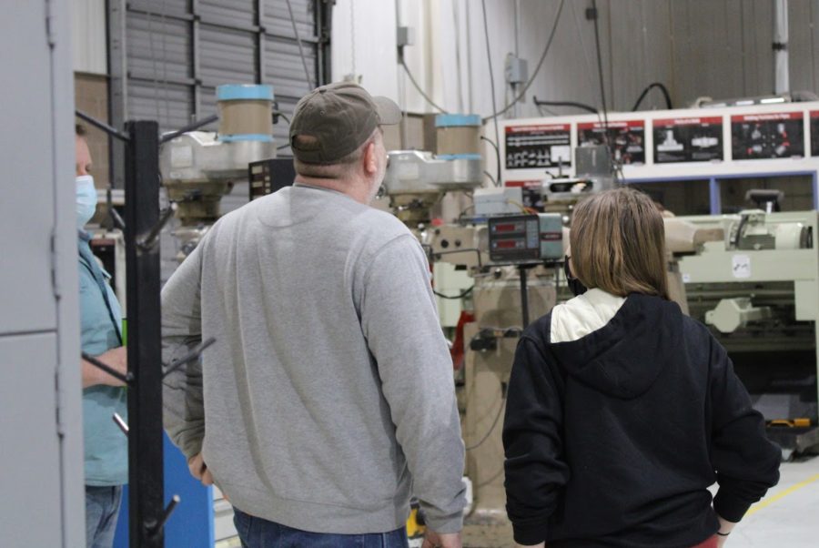 A parent admires the equipment available at the Century Career Center.
