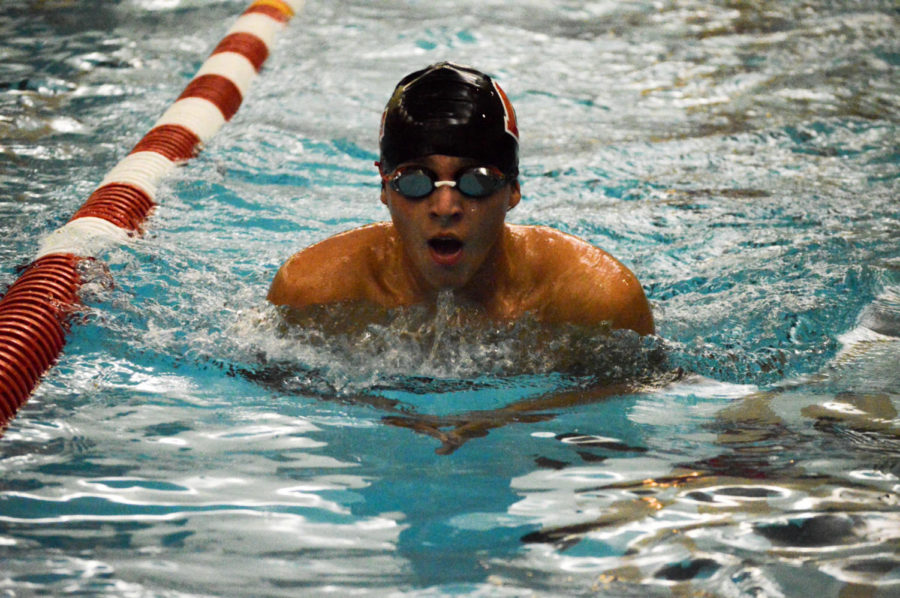 Senior Mitchell Albright performs breaststroke during practice.