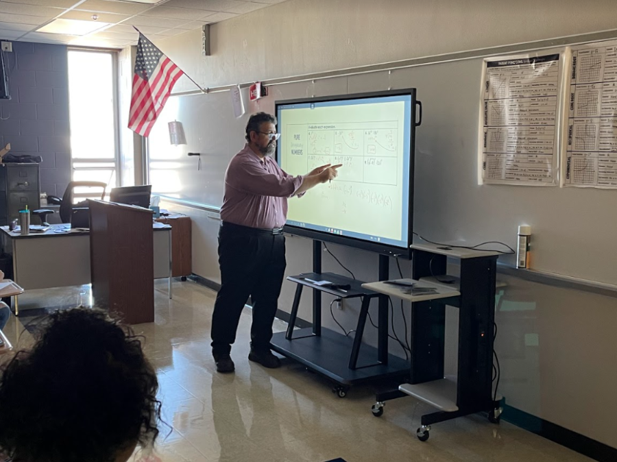 In a more advanced classroom, math teacher Michael Grenard teaches some more advanced problems on his Clevertouch board. 