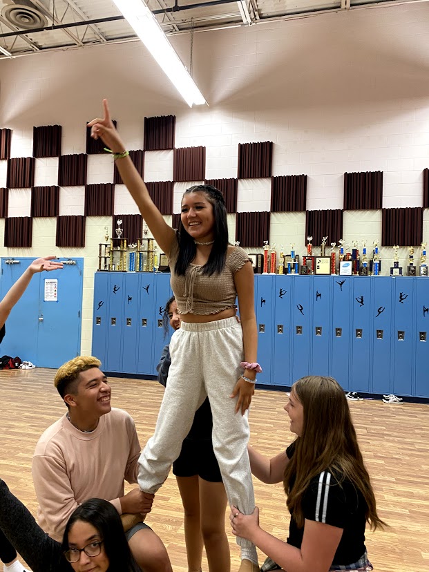 Sophomore Ivy Padilla, junior Natalie Galvan, and freshman Kailyn Langley practicing an ending pose for a dance routine. 