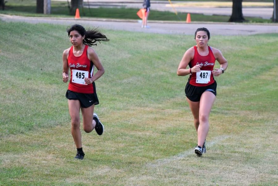 Senior Jessica Mateo-Pascual and junior Gabbyryonna Richie run hard towards the finish line.