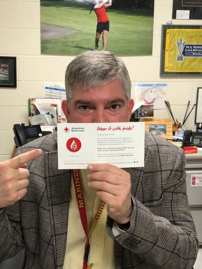 Band Teacher Ned Boyd was awarded a pin to celebrate giving three gallons of blood.