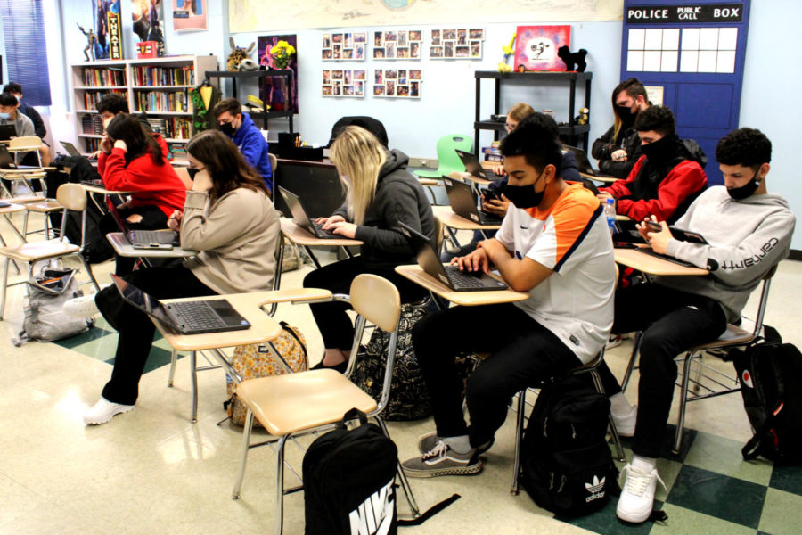 Students work on their laptops during third period.