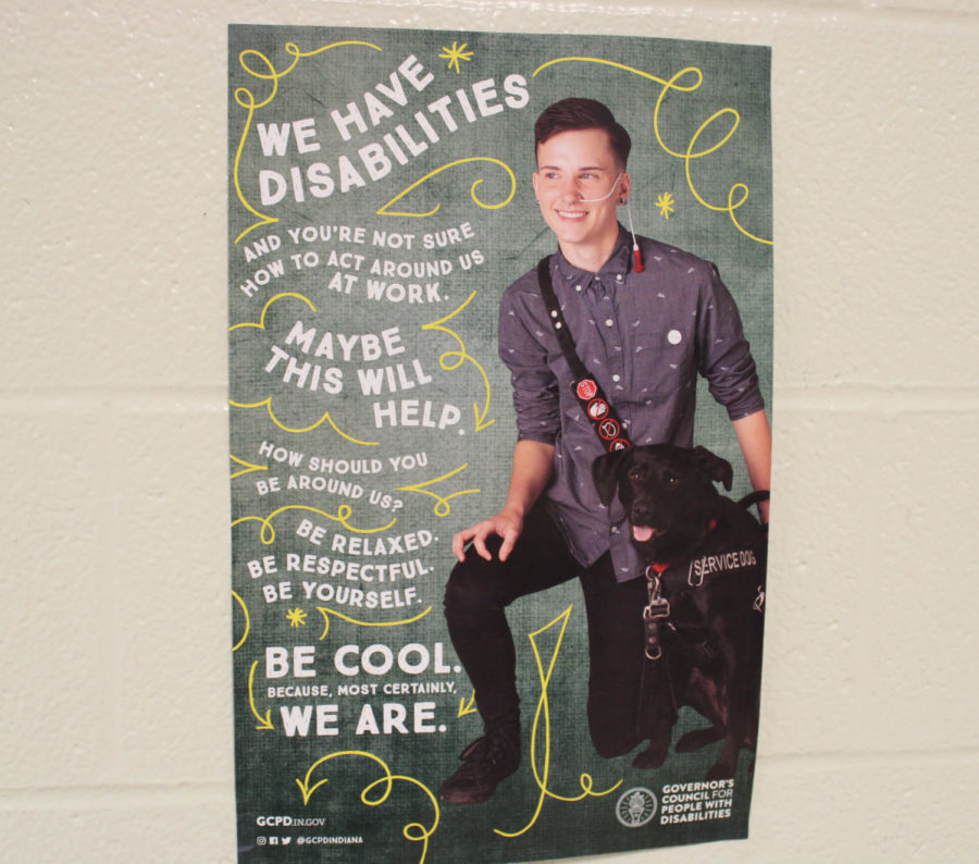 This is another one of the few disability awareness posters around the school. This one in particular depicts someone with a service dog. 