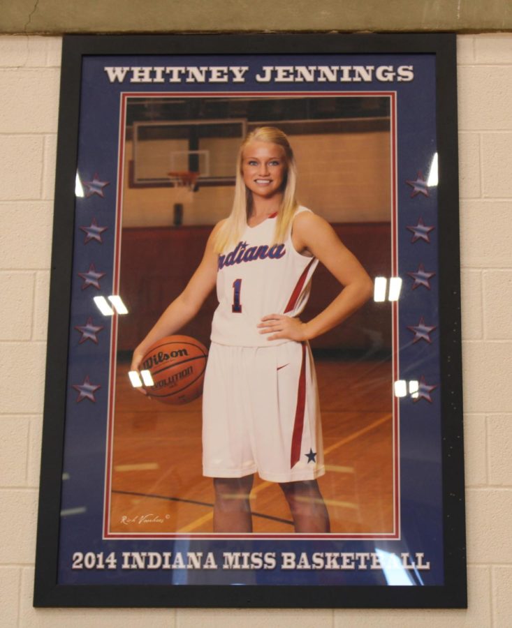 A framed picture of the 2014 Indiana Miss Basketball winner, Whitney Jennings, hangs from the wall at the Berry Bowl. 