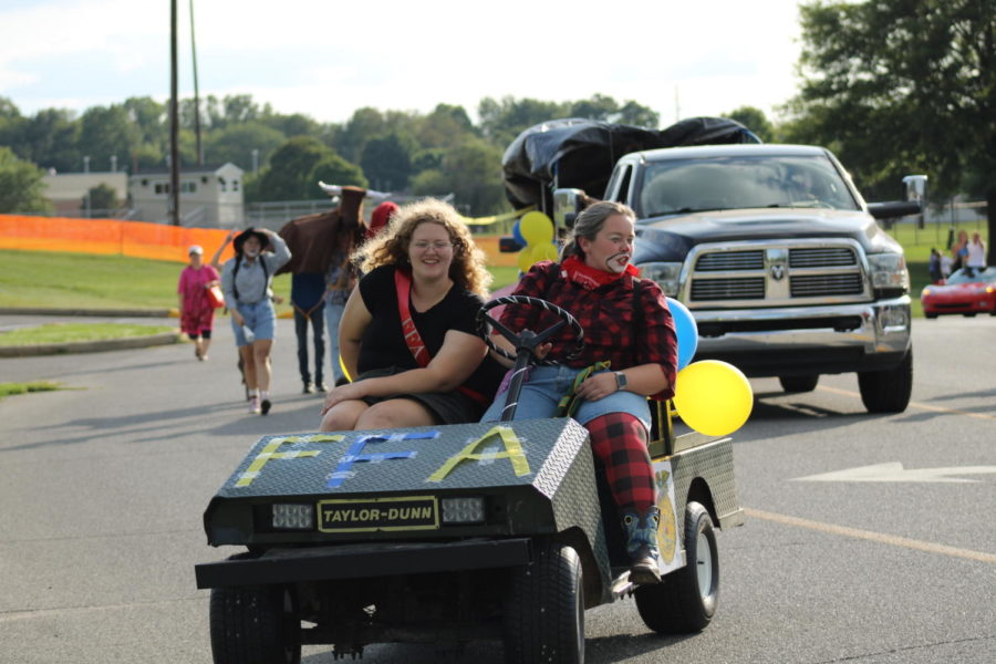 Driving in the parade, FFA Homecoming queen candidate Graci Homburg and sponsor Jennifer Fishburn lead the F.F.A. contingent in the parade.