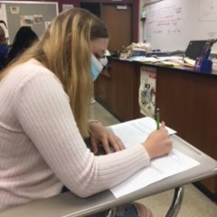 Sophomore Alexis Enyeart concentrates on her chemistry homework.