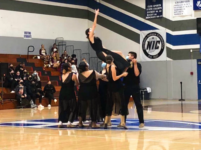 Junior Bassma El-Zoubi falls and is caught by the rest of the team in their lyrical dance. 