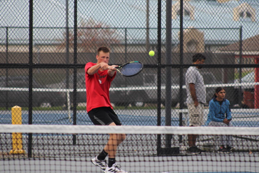 Junior+Dylan+Pearson+follows+through+after+making+contact+with+the++ball+during+the+Logansport+vs.+Lafayette+Jeff+tennis+match.