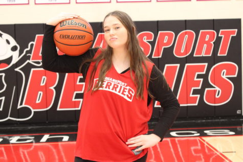 Freshman Golda Kitchell poses with a basketball on the Berry Bowl court. 