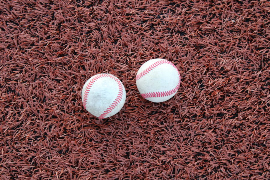 A pair of baseballs lay on the new synthetic turf before baseball practice at Jim Turner Field on April 20, 2022. 