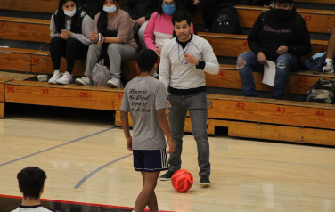 Spanish teacher Andres Valencia gives instructions as referee.