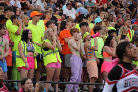 The Logansport student section dresses in neon while tightly compacted together to cheer on the Berries against the Kokomo Wildkats on Friday, Sept. 1, 2022, at Logansport Memorial Hospital Stadium. 