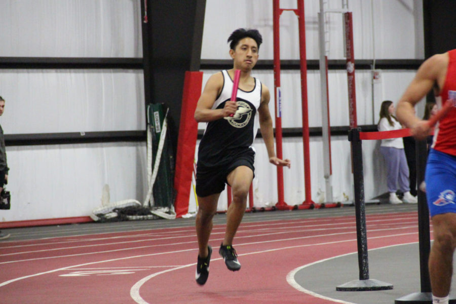 Senior Andrew Balbuena running the 4x400 relay, a race where 4 people in a team run two laps around a track. 
