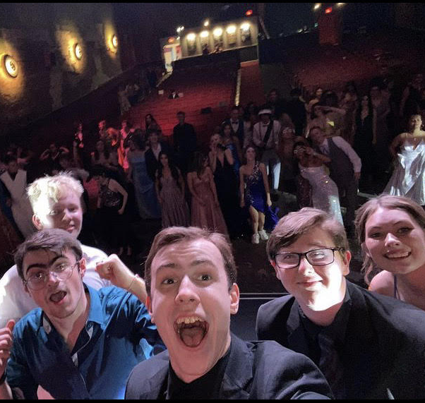 Sophomore servers Payton Mucker and Finley Gay went onto the stage with friends to try and get the crowd excited at prom.

