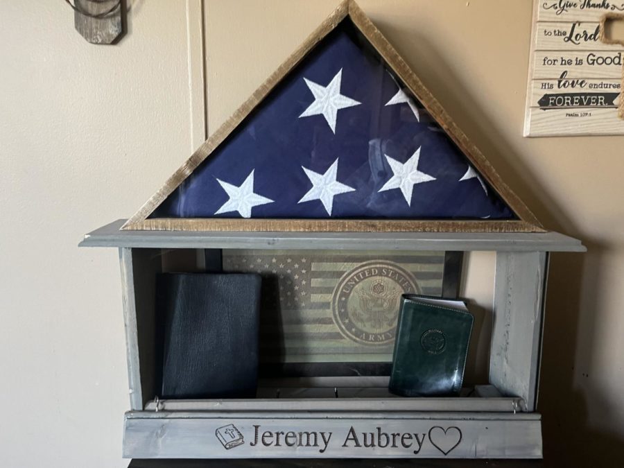 Made for Jeremy Aubrey after his passing was a custom made memorial set up. In this structure was the flagged folded for him during his funeral. This flag was then presented to his wife by his own son. There is also a  custom made bible and the bible he received in the Army.