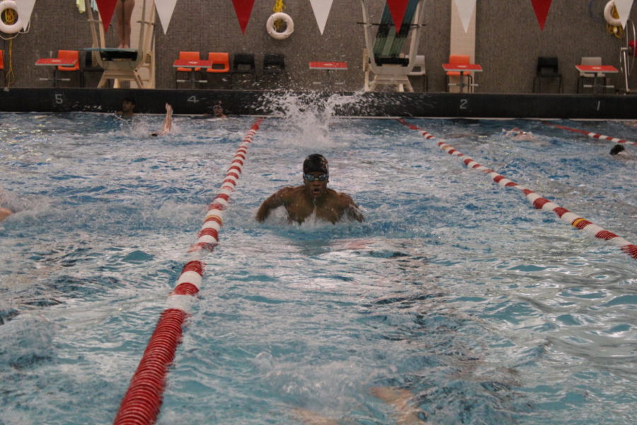 Berry Alumni Jaden Chin-Hong swims in lane three of the Logansport High School Pool during the swim teams practice.