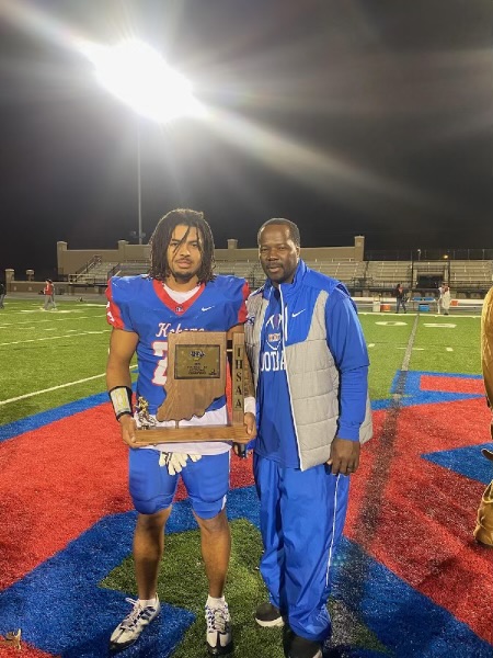 Jason Spear and his son Shayne Spear posing with the Class 4a Sectional 20 trophy. 