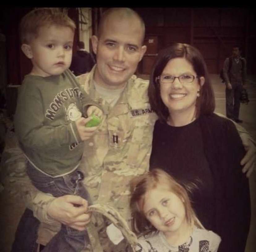 Standing with his family, Sean Moore, just arrived home from his deployment in Afghanistan. 