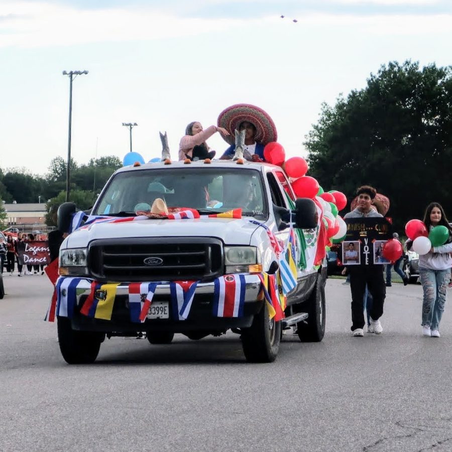 Spanish Clubs Homecoming candidates riding in parade.