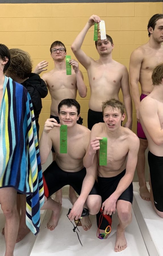 Logansports 400 Free relay team poses for a picture inside the Boilermaker Aquatic Center on Saturday, Jan. 7.