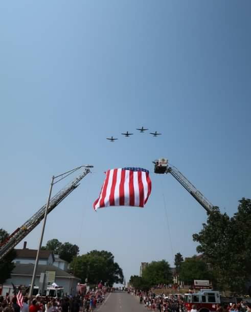 Four A-10s perform a flyover in a Missing Man Formation during the funeral procession of Cpl. Sanchez.