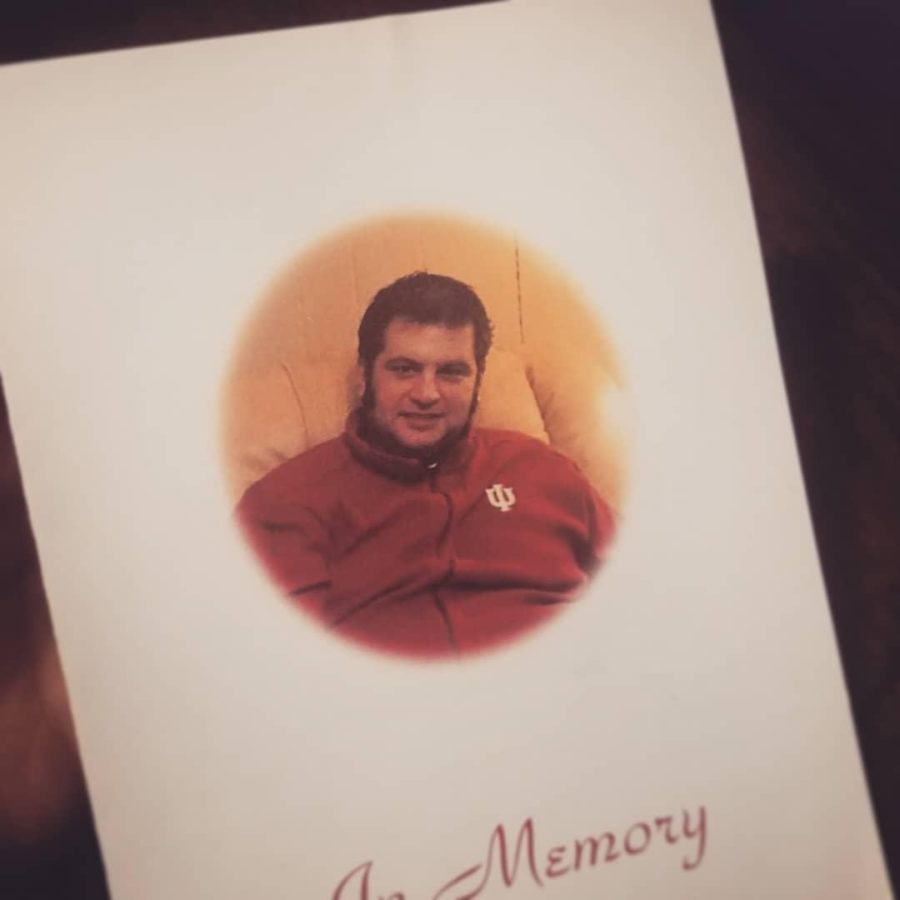 Chad Lamberts memorial card lies on a table at his funeral. 