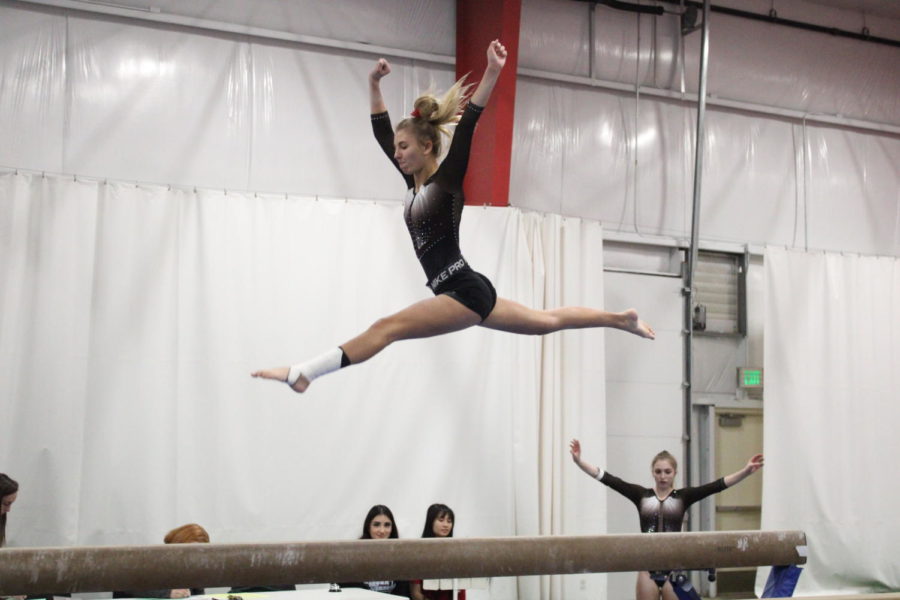 During the Logansport Invitational, freshman Rylee Zimmerman performs her beam routine.