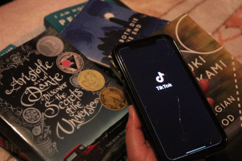 While opening up TikTok to get more titles, a pile of TikTok-recommended books can be seen in the back. Big names such as They Both Die at The End, Norwegian Wood and Aristotle and Dante Discover The Secrets of The Universe have been shared through the entertainment app.