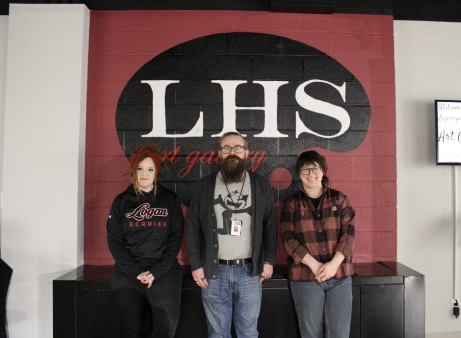 Art+teachers+Nicole+Ingalls%2C+Bryan+Hole+and+Charmaine+Griffith+pose+in+the+LHS+art+gallery.+Ingalls+is+the+3-D+art+teacher+and+has+been+at+Logansport+High+School+for+two+years+now.+Hole+is+the+2-D+art+teacher+and+has+been+working+at+the+high+school+for+about+sixteen+years.+This+year+is+Griffith%E2%80%99s+first+time+working+at+the+high+school.+Before+teaching+here%2C+she+used+to+work+at+the+Logansport+Junior+High+School.+