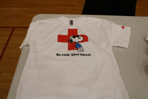 Each individual blood donor gets a Red Cross Snoopy shirt fitting for their size.