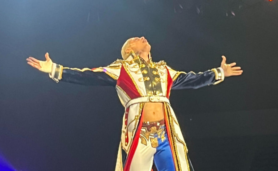 Superstar Cody Rhodes  embraces the crowd during his entrance. 