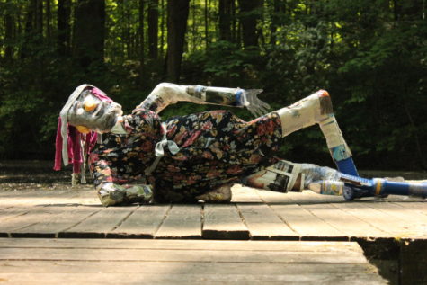 Inspired by seeing their friend lounge about, the creators of La Mamacita  decided to pose her laying down. The 3D sculpture class used plastic, old fabric, and bottle caps in order to make these sculptures.