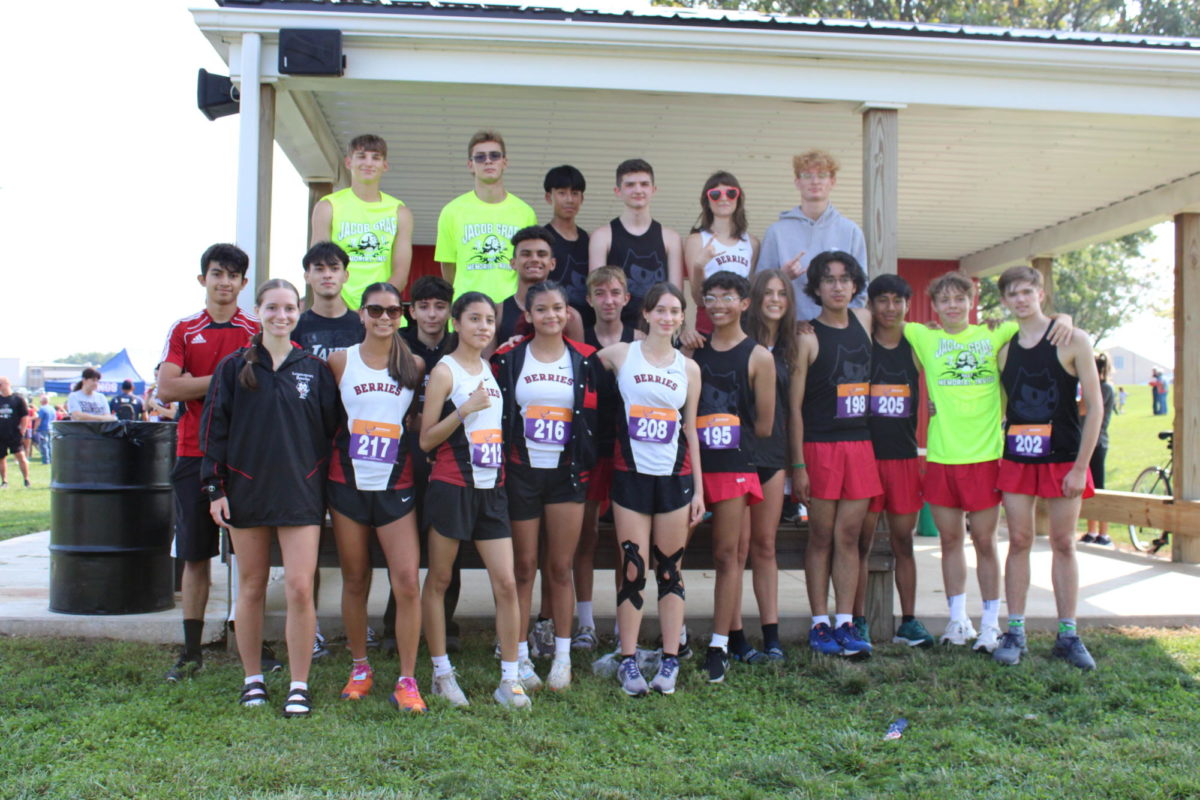 Members of the cross country team stand in front of the pavilion during the Jacob Graff Memorial Invitational on Aug. 19th.