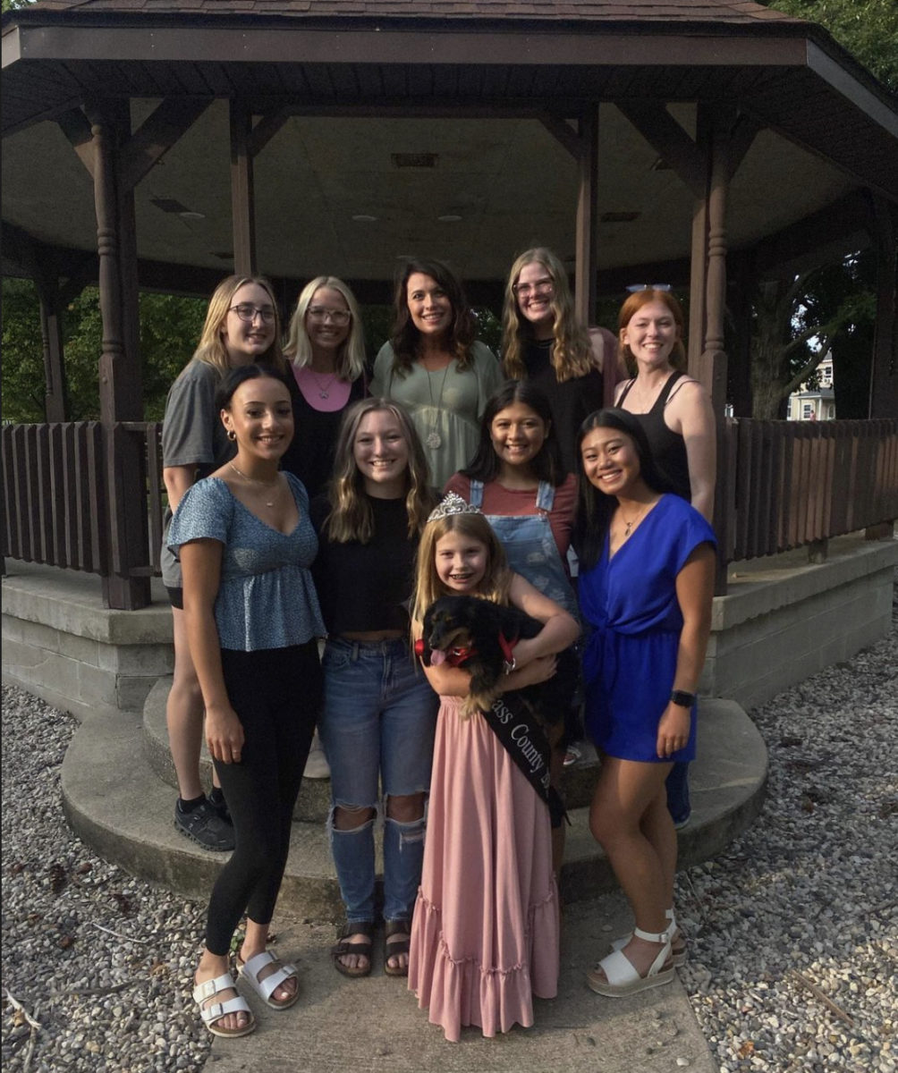 The Miss Oktoberfest contestants and Teen Miss girls pose for a picture with Grace Scott and Little Miss Cass County Quinn Scott. Grace Scott spoke to the girls about confidence.