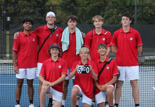 After finishing their matches against the Lewis Cass Kings, the Logansport High School boys tennis team poses for a picture. The Berries were able to beat the Kings 5-0 on their first day of sectionals.
