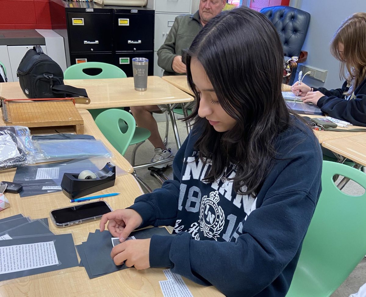Deep in focus, senior Emily Sanchez, works on her Programmed Oral Interpretation(POI) speech. Although memorization is optional, a small binder that contains the speech is allowed.