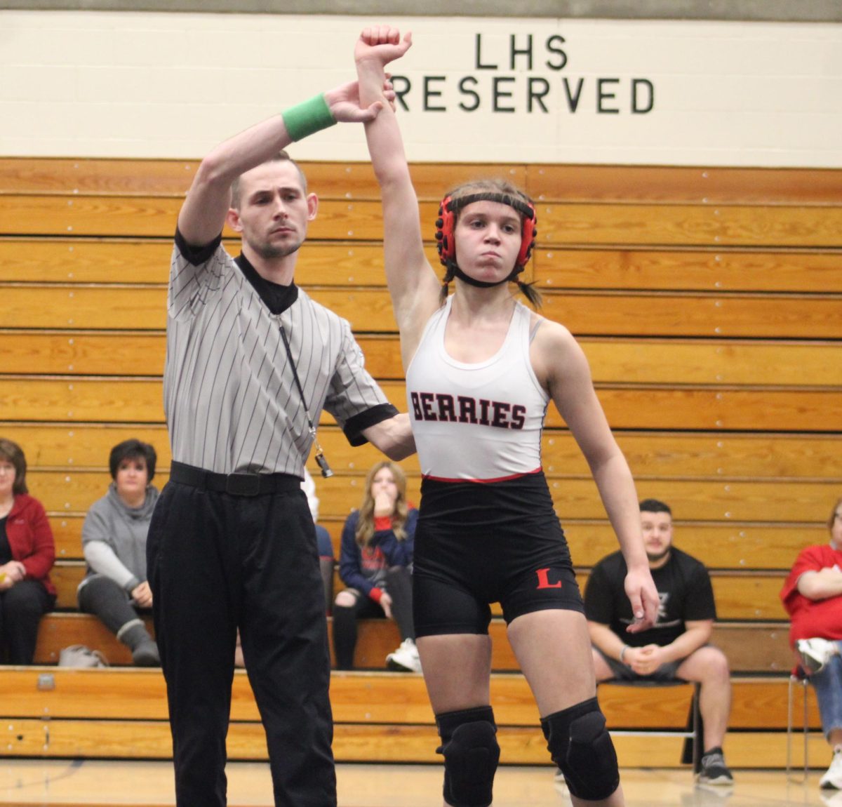 Having her hand raised in victory, sophomore Olivia Gibson defeated a Lewis Cass High School male wrestler last season.