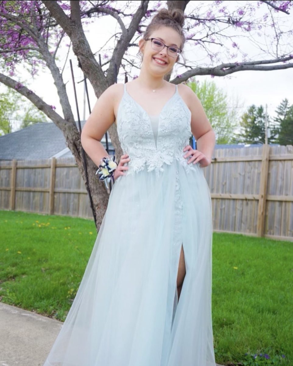 Senior Leah Alder poses in her very first prom. It was teal with a slit on the side. 