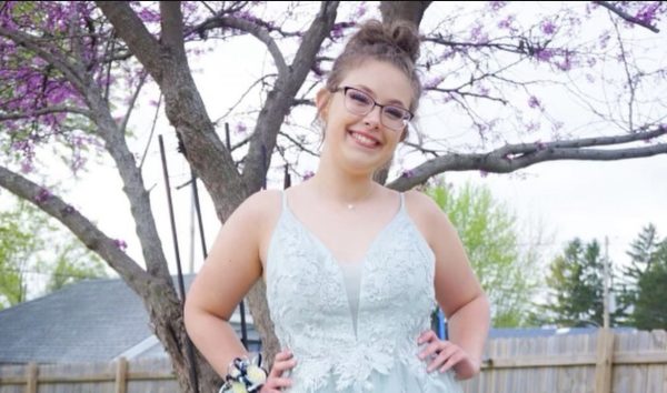 Senior Leah Alder poses in her very first prom. It was teal with a slit on the side. 