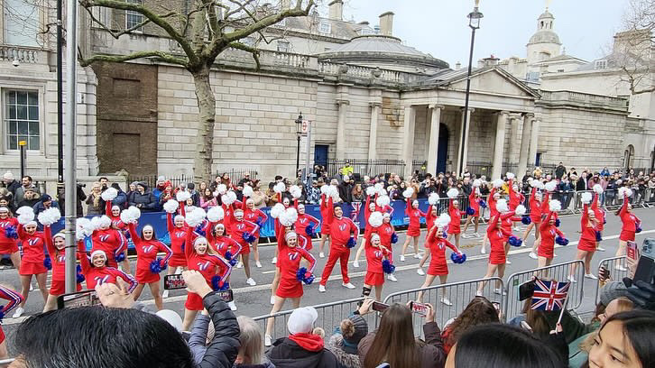 The All-American cheer team performs a dance for the spectators at the London New Years Day Parade. The team traveled about two miles in total and stopped every couple of yards to dance to Shake it Off by Taylor Swift. 