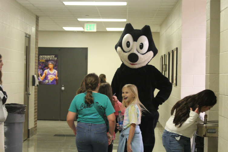 Children are filled with joy as LHS Mascot Felix the Cat greets them.