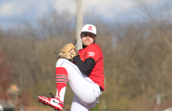 Preparing to throw the ball down to the plate, senior Cooper Smith attempts to strike out his opponent. 