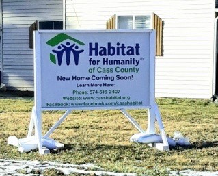 A Habitat for Humanity sign goes on a home which was being constructed.