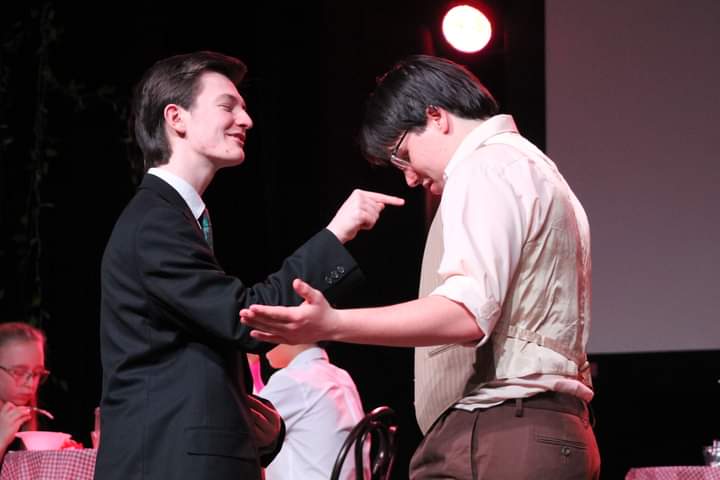 LHS juniors Cameron Hunnicutt and Alex Geisler perform during JCTs most recent dinner theatre show, Who Poisoned His Meatball?