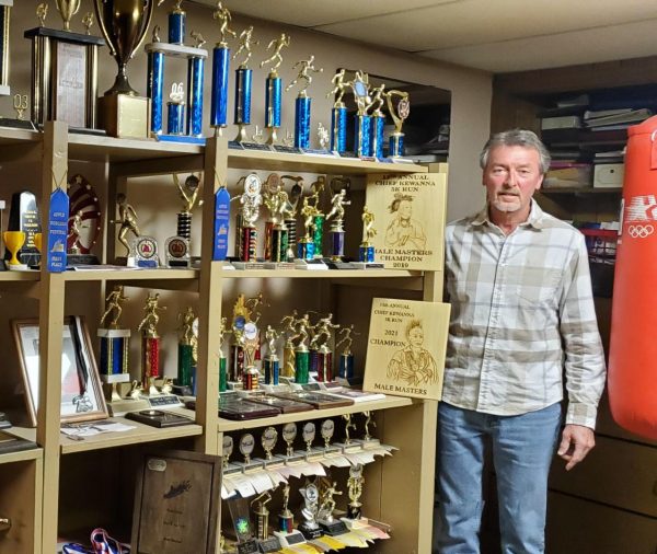 Custodian Brian VanSoet shows awards he has won throughout his life.