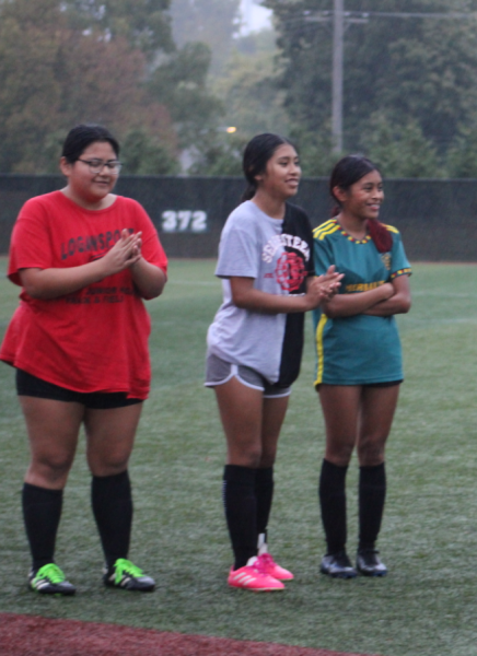 Freshmen Magdalena Sebastian, Isabel Hernandez and Fabiana Lopez cheer on the team. 