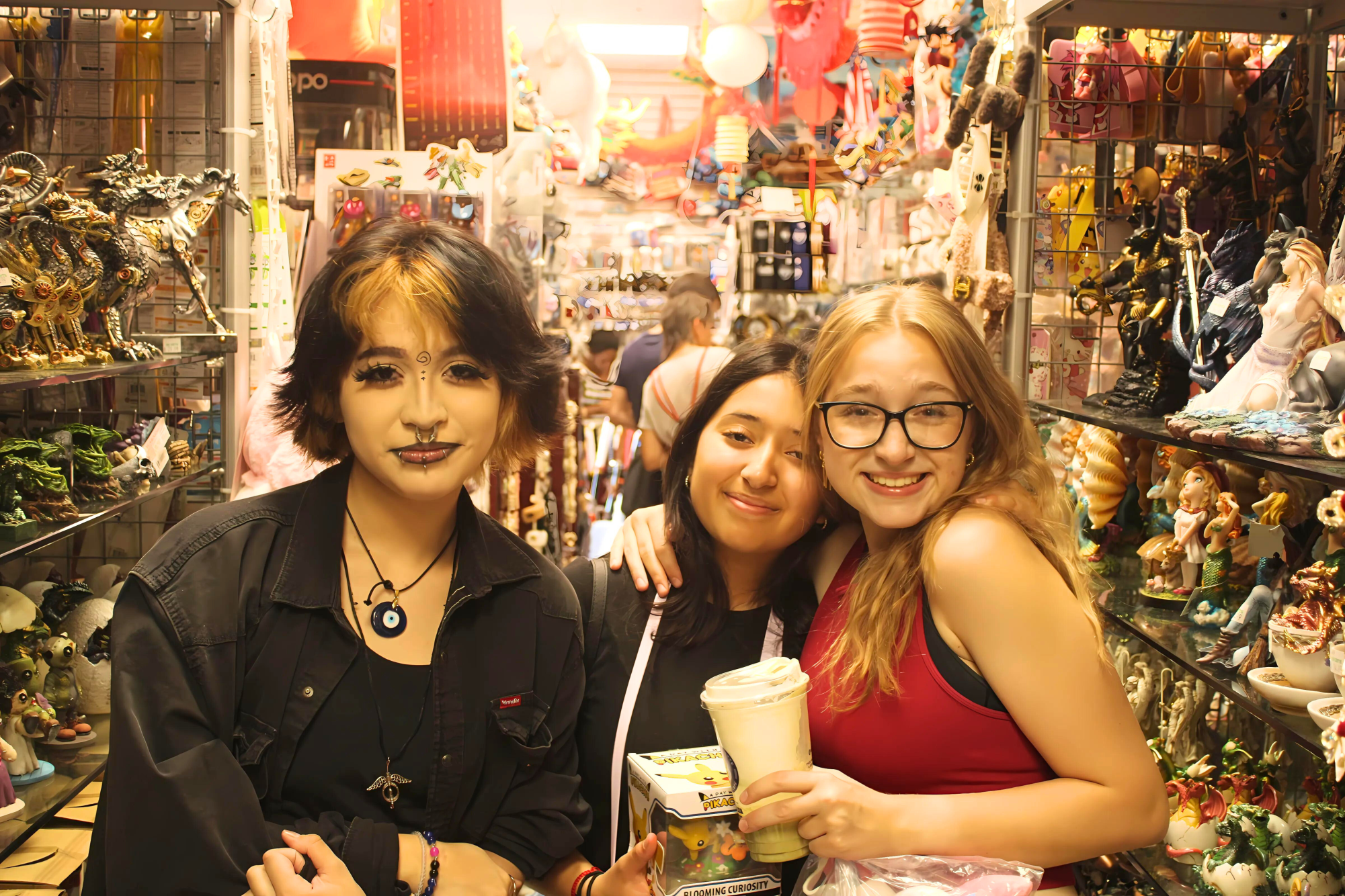 Juniors Dominic, Saylor McClain, and Allison Miranda-Castro pose for a picture after checking out souvenirs and enjoying tasty treats in Chinatown.