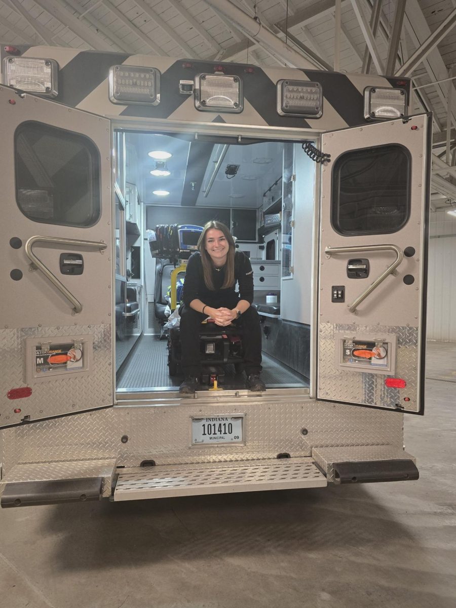 Paramedic Robert Zimmerman stands in front of a Cass County ambulance. Afterwards, he was able to return to work and continue as normal. (Courtesy of Flaude Dillon)